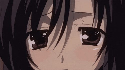 a close up of a girl 's face with a tear running down her cheek