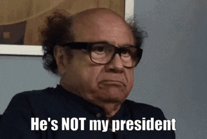 a bald man wearing glasses is making a funny face and saying he 's not my president .