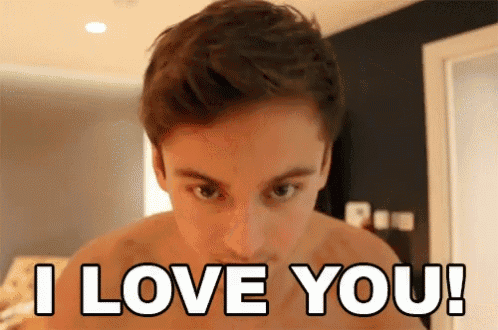 a shirtless man says " i love you " in front of his face