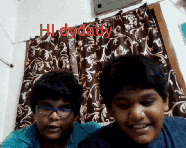 a man and a boy are smiling in front of a curtain that says hi-dydaddy on it