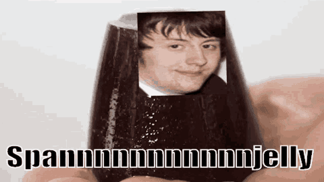 a person is holding a jelly with a picture of a man on it and the words spannmmmmmmjelly