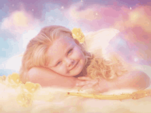 a little girl with angel wings and a yellow flower on her head