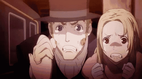 a man and a girl are standing next to each other in a dark room .