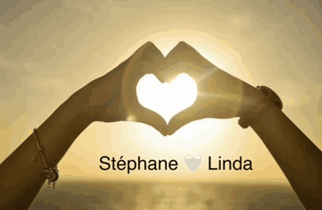 a couple making a heart shape with their hands with stephane and linda written below them