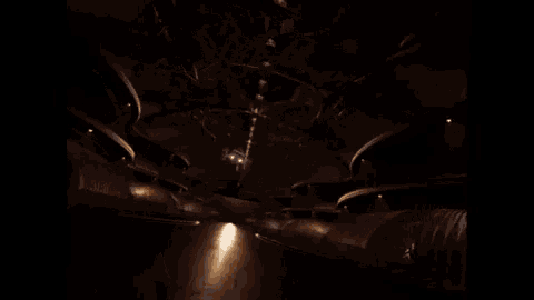 a very dark room with a few lights on