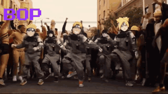 a group of people are dancing on a street with the word bop above them