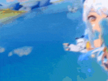 a blurry picture of a girl with white hair standing in front of a blue water surface .