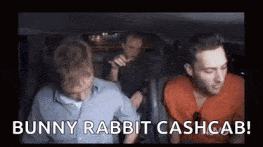 a group of men are sitting in the back seat of a car talking about bunny rabbit cashcab .