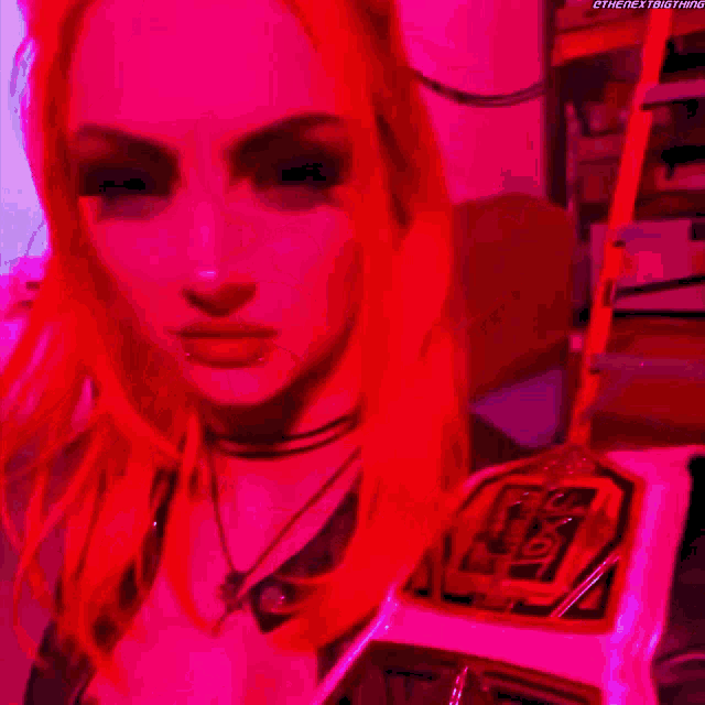 a woman with red hair is wearing a choker and a cross necklace .