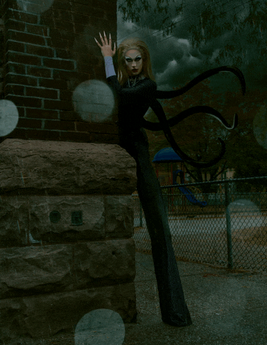 a woman with long legs is standing in front of a fence