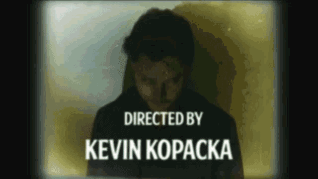 kevin kopacka is directing a movie with a man in the background