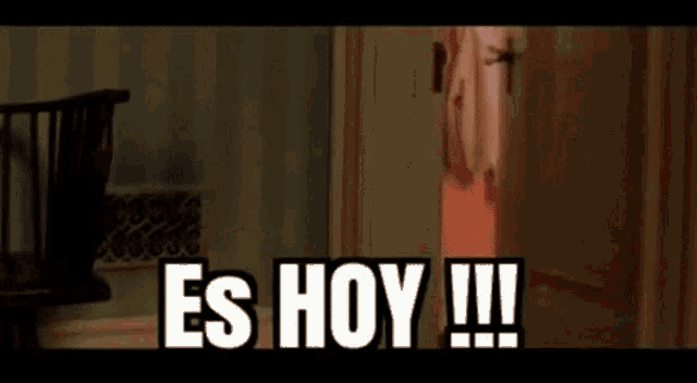 a person standing in a doorway with the words es hoy