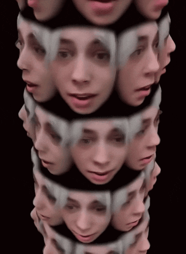 a stack of faces with a black background