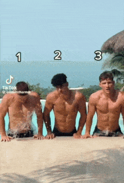 three shirtless men are standing next to each other in front of a swimming pool .