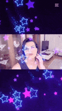 a woman 's face is surrounded by neon stars and the letter m is visible in the corner