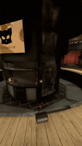 a room with a sign that says " the black cat " on it