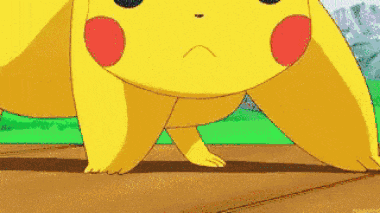 a close up of a cartoon character standing on its hind legs on a wooden surface .