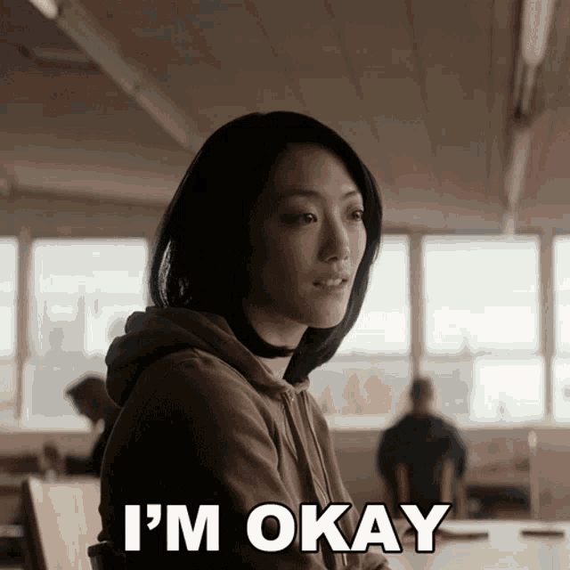 a woman says i 'm okay in a room