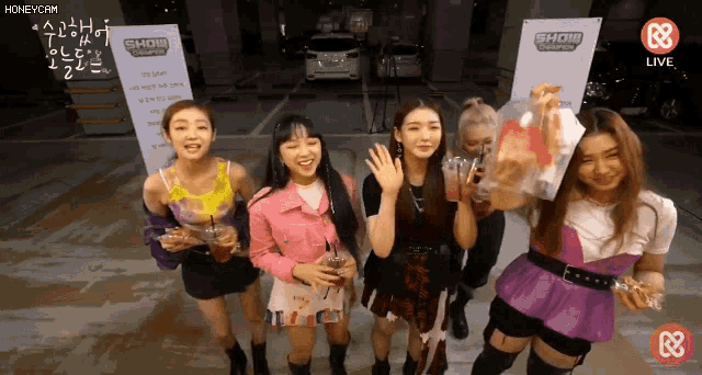 a group of girls standing in front of a sign that says show choice