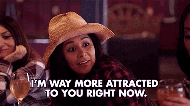 a woman wearing a cowboy hat is saying i 'm way more attracted to you right now