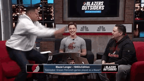 three men are sitting in front of a screen that says blazers outsiders on it