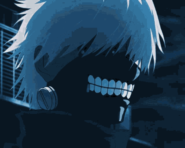 a blurry picture of a person 's face with a blue light behind them