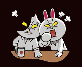 a cat and a rabbit are sitting at a table with a cup of coffee .