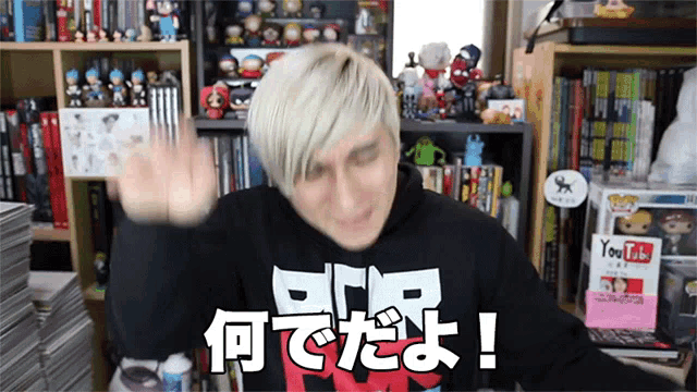 a man wearing a black shirt that says " you tube " on it