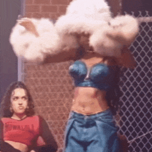 a woman wearing a crop top that says ronaldo