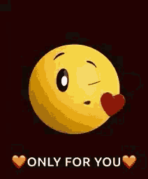 a yellow smiley face is holding a red heart in its mouth .