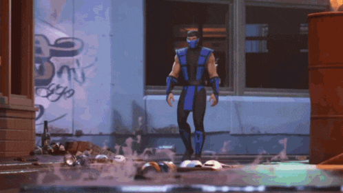 a man in a blue suit stands in front of a building with graffiti on it that says ' dirty '