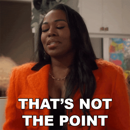 a woman in an orange coat says that 's not the point in white letters