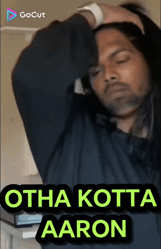 a man with long hair is holding his head with the words otha kotta aaron on the bottom