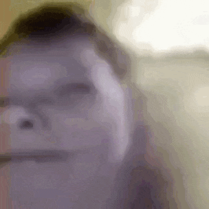 a close up of a man 's face with glasses and a headache .