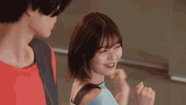 a man and a woman are standing next to each other and the girl is smiling