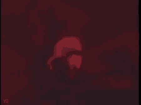 a close up of a person 's face in a dark room with red lights .