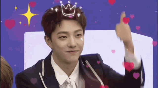 a young man with a crown on his head is surrounded by hearts