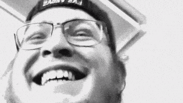a man wearing glasses and a hat that says " 2adev 2aj "
