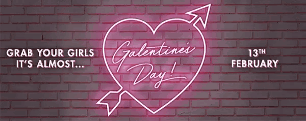 a neon sign on a brick wall says valentine 's day