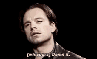 a close up of a man 's face with the words `` whispers '' damn it .