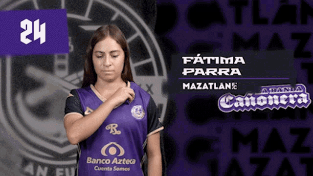 a woman is wearing a purple shirt with the number 24 on it