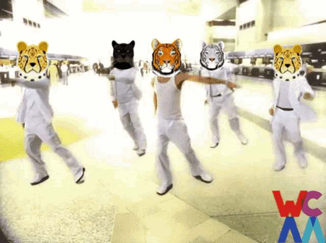 a group of people with tiger masks on their faces dancing