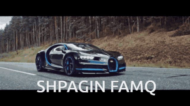 a black and blue sports car is driving down a road with the words shpagin famq above it