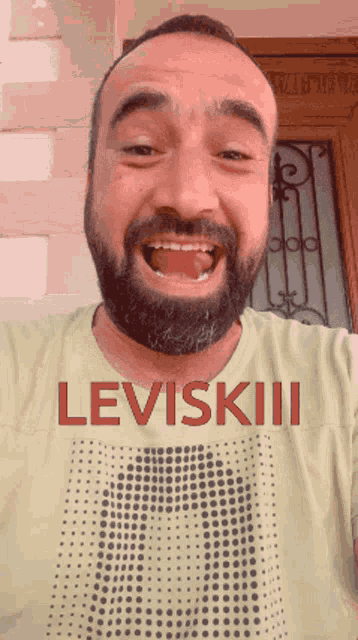 a man with a beard wearing a leviskii shirt