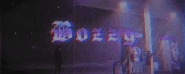 a person is standing in front of a sign that says ozzy
