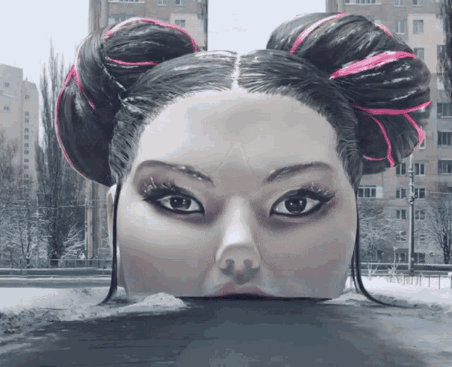 a painting of a woman 's face with a bun on her head