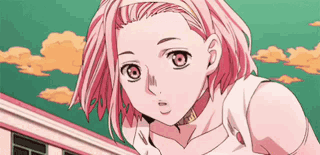 a girl with pink hair is standing in front of a building and looking at the camera .
