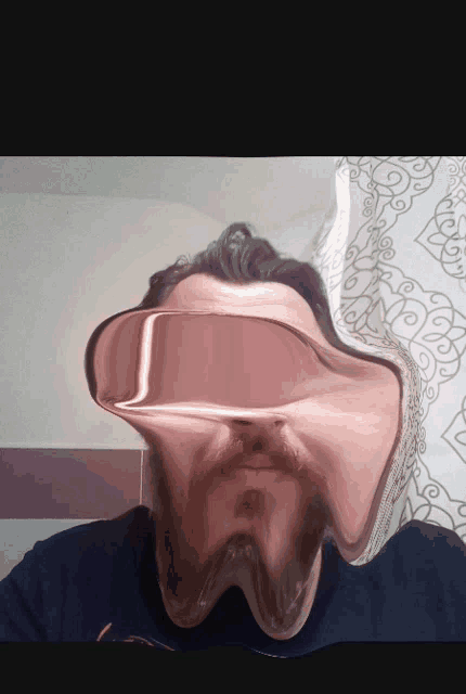 a man with a beard and mustache has a strange face