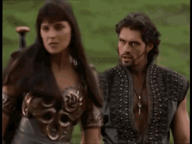 a man and a woman are standing next to each other and the woman is saying trust me xena