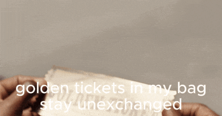 a person holding a piece of paper that says golden tickets in my bag stay unchanged